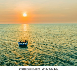 Aerial view of basket boat going out to catch fish in the morning in the central coast of Vietnam - Powered by Shutterstock