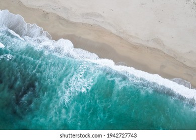 Aerial view of beach and ocean with waves. Drone view of sea. Galicia, Spain.