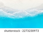 Aerial view with beach in wave of  turquoise sea water shot, Top view of beautiful white sand background 