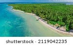 Aerial view of beautiful Bavaro beach in Punta Cana, Domincan republc. Hot sunny day on tropical beach full of palms.