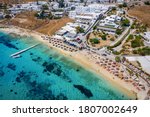 Aerial view of the beautiful beach of Agios Ioannis Diakoftis on the island of Mykonos, Greece, with turquoise sea