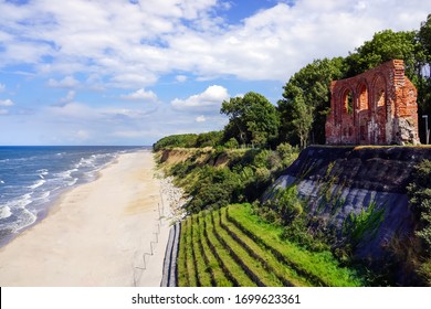 Aerial View Of Beautiful Beach, Sea And Ruins Of Church In Trzesacz, Poland. Bright Sunny Day. Empty And Closed Due To Covid 19 Or Coronavirus