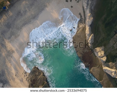 Similar – Aerial Drone View Of Dramatic Ocean Waves Crushing On Rocky Landscape