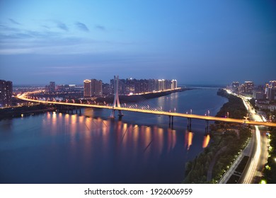 Aerial View Of Beautiful Bridge At Night And City Skyline In China