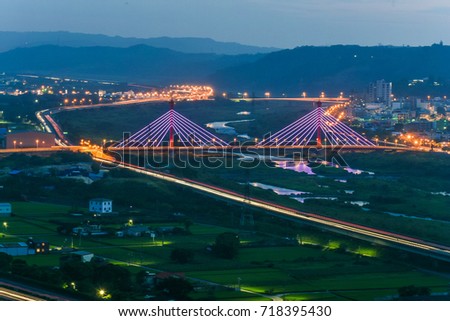Aerial View of a Beautiful Cable-Stayed Bridge and Highway #1 with Miaoli City From Ink Mountain at Night, Miaoli , Taiwan