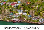 Aerial view of beautiful colorful houses built on the rocky slope of the Signal Hill in St. John