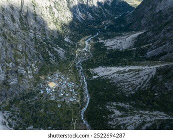 Aerial view of beautiful high altitude forest canyon and snow capped mountain landscape - Powered by Shutterstock