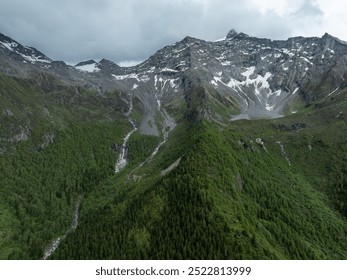 Aerial view of beautiful high altitude snow capped mountain waterfall landscape - Powered by Shutterstock