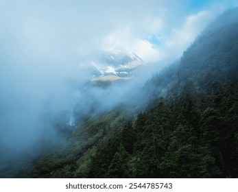 Aerial view of beautiful high altitude snow capped mountain forest and waterfall landscape - Powered by Shutterstock