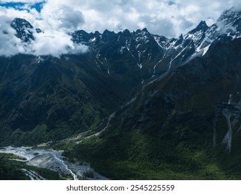 Aerial view of beautiful high altitude snow capped mountain and waterfall landscape - Powered by Shutterstock