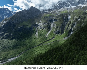 Aerial view of beautiful high altitude snow capped mountain and waterfall landscape - Powered by Shutterstock