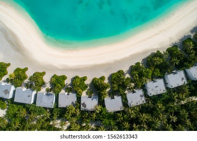 Aerial View Of Beautiful Island At Maldives In The Indian Ocean. Top View From Drone. 