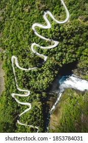 An Aerial View Of A Beautiful Landscape With Tree Forests And A Curvy Road In Norway