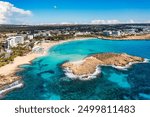 Aerial view of beautiful Nissi beach in Ayia Napa, Cyprus. Nissi beach in Ayia Napa famous tourist beach in Cyprus. A view of a azzure water and Nissi beach in Aiya Napa, Cyprus.