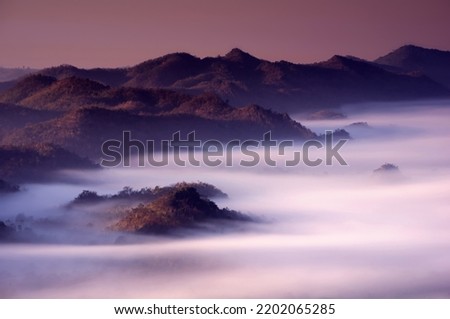 Aerial view Beautiful  panorama of morning scenery Golden light sunrise And the mist flows on high mountains forest. Pang Puai, Mae Moh, Lampang, Thailand.