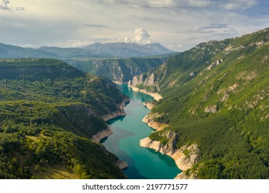 Aerial view of Beautiful Piva river canyon with reservoir Piva Lake (Pivsko Jezero) summer view in Montenegro. Nature travel background. - Powered by Shutterstock