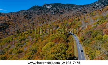 Aerial view of beautiful rock formations along the North Carolina mountains as the leaves start to change during the first part of fall.
