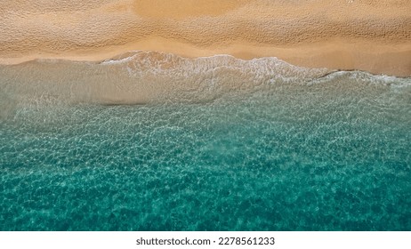 Aerial view of beautiful sandy beach and soft turquoise ocean wave. Tropical sea in summer season on Megali Petra beach on Lefkada island. - Shutterstock ID 2278561233