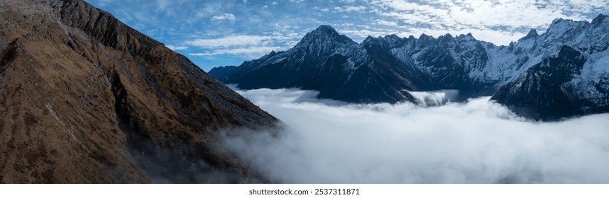 Aerial view of beautiful snow capped mountains and autumn forest landscape - Powered by Shutterstock