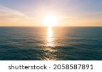 Aerial view Beautiful view sunset over sea surface beautiful wave Amazing light sunset or sunrise sky over sea beach with wave crashing in the ocean.nature background