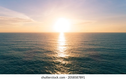 Aerial view Beautiful view sunset over sea surface beautiful wave Amazing light sunset or sunrise sky over sea beach with wave crashing in the ocean.nature background