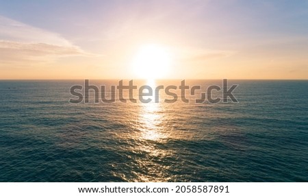 Aerial view Beautiful view sunset over sea surface beautiful wave Amazing light sunset or sunrise sky over sea beach with wave crashing in the ocean.nature background