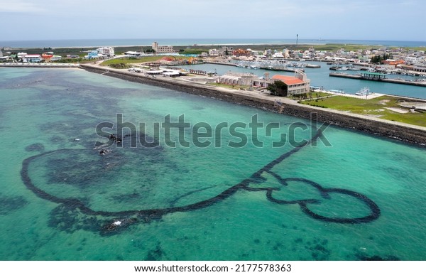 Aerial\
view of the beautiful Triple-Heart Stacked Stones or Three-Heart\
Fish Trap, which is a fishing weir and a famous tourist destination\
on Jibei Island, in Baisha, Penghu County,\
Taiwan
