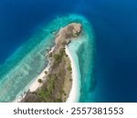 Aerial view of a beautiful tropical island surrounded by clear blue waters.