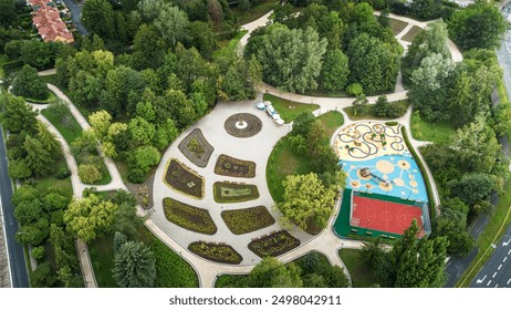 Aerial View of a Beautiful Urban Park With Playground and Garden Spaces in Springtime - Powered by Shutterstock