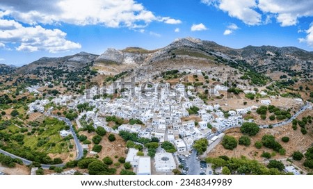Aerial view of the beautiful village Apeiranthos with the whitewashed houses beneath steep mountains, Naxos island, Cyclades, Greece