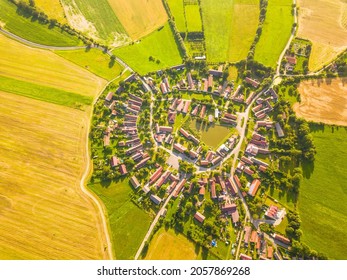 Aerial view of beautiful village in summer countryside. Old village Lipnice in Brdy, Czech republic, Europe. Rundling is a form of circular village. Typical medieval settlement. - Powered by Shutterstock