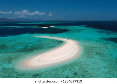 Aerial View Of Beautiful White Sand Island In Shallow Ocean With Blue Sky At Labuan Bajo Indonesia