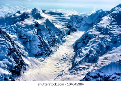 Aerial View of the Beginning of a Glacier, Denali National Park, Alaska.  A Sculpture of Snow and Ice. - Powered by Shutterstock