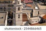 Aerial view of the bell tower of the Cathedral of Santa Maria Assunta located in the historic center of the city of Andria, in Puglia, Italy.