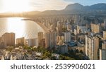 Aerial view of the Benidorm cityscape at sunset, Valencian Community, Costa Blanca, Spain. Skyscrapers of Benidorm resort city at the Eastern coast of Spain.