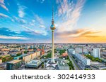 Aerial view of Berlin skyline with famous TV tower at Alexanderplatz and dramatic cloudscape at sunset, Germany