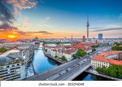 Aerial view of Berlin skyline with famous TV tower and Spree river in beautiful evening light at sunset, Germany