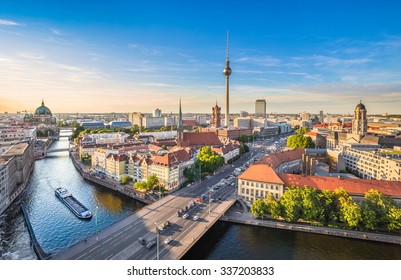 Aerial view of Berlin skyline with famous TV tower and Spree river in beautiful evening light at sunset in summer, Germany