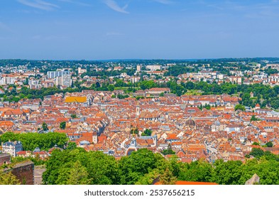 Aerial view of Besancon old town centre ville La boucle with red tiled roofs of medieval buildings, Besançon city historic centre skyline in sunny summer day, Bourgogne-Franche-Comte region, France - Powered by Shutterstock