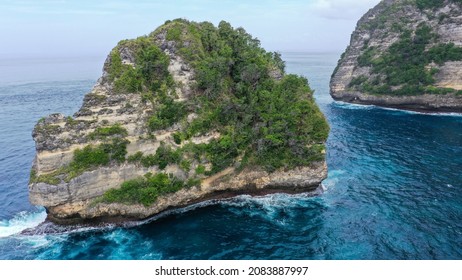 Aerial View Of Big Cliff On Coast, Dron Fly Through Hole In Cliff. Zoom-out Of Giant Rock In Golden Bay To Wide Landscape.