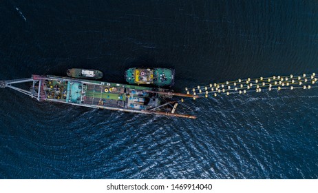 Aerial View Of Big Fishing Trawler Boat In Ocean  With Two Small Boats , Drone Shot , 