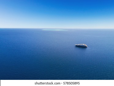 Aerial view of big luxury yacht in sea, copyspace for text