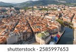 Aerial view of the Bilbao old town, Basque country, Spain. Casco Viejo de Bilbao with red tiled rooftops and historic seven streets in Bilbao city.