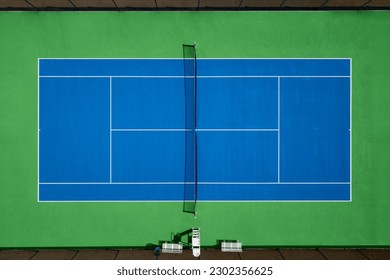 Aerial view of blue and green tennis hard court. - Powered by Shutterstock