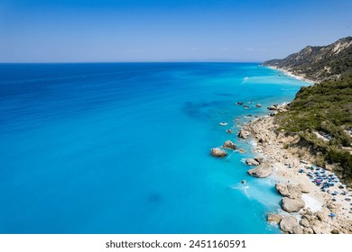 Aerial view of blue sea, rock, beach in summer. Gaidaros beach, Lefkada island, Greece. sea coast, rocks, trees, azure water - Powered by Shutterstock