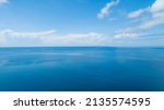 Aerial view of a blue sea surface water texture background and sun reflections Aerial flying drone view Waves water surface texture on sunny tropical ocean in Phuket island Thailand