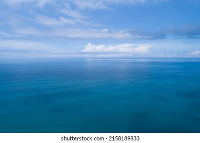 Aerial view of a blue sea surface water texture background and sun reflections Aerial flying drone view Waves water surface texture on sunny tropical ocean in Phuket island Thailand - Shutterstock ID 2158189833