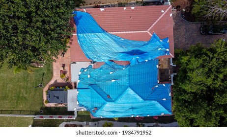 Aerial View Of The Blue Tarp Roof