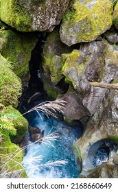 Aerial view of blue water and eroded rocks in The Chasm, Cleddau River, New Zealand, Fiordland National Park