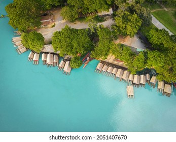 Aerial View Blue Water River, Top View Sea Blue Lagoon Pond Water From Above, Bird Eye View Green Tree And Bamboo Raft House And Wooden Boat On Water Surface Beautiful Fresh Environment Landscape Lake